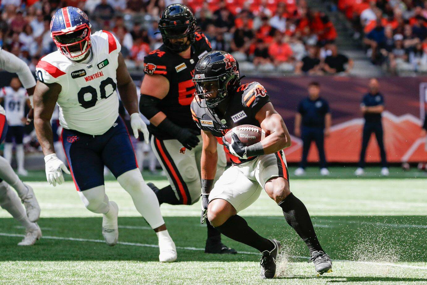 Lions running back Shaun Shivers looks for a gap against the Montreal defence. Shivers would finish with 136 yards of offence in his CFL debut. Photo courtesy of Steven Chang, B.C. Lions