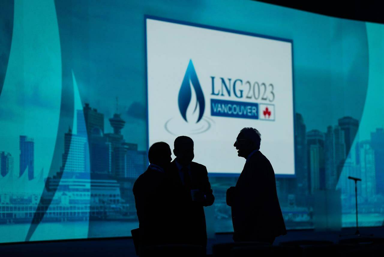 Delegates are silhouetted before the start of the LNG 2023 conference, in Vancouver, B.C., Monday, July 10, 2023. Officials from the LNG industry gathering in Vancouver for an industry conference say the consensus among economists is that the gas shortage in Europe is a situation unlikely to last beyond 10 years, with the rise of renewables cutting into demand from 2030 onward. THE CANADIAN PRESS/Darryl Dyck