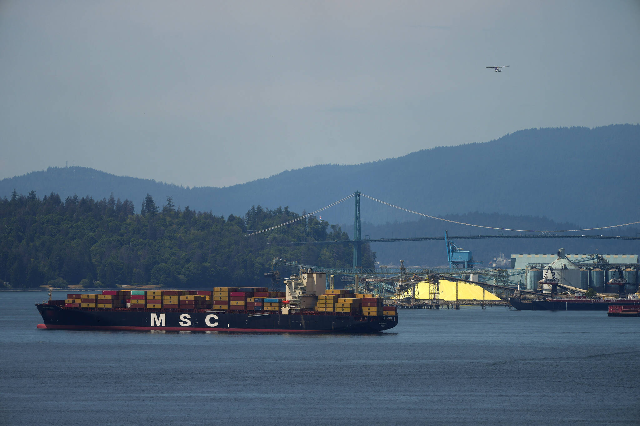A cargo ship sits at anchor on the harbour during a strike by International Longshore and Warehouse Union Canada port workers in the province, in Vancouver, on Wednesday, July 12, 2023. THE CANADIAN PRESS/Darryl Dyck