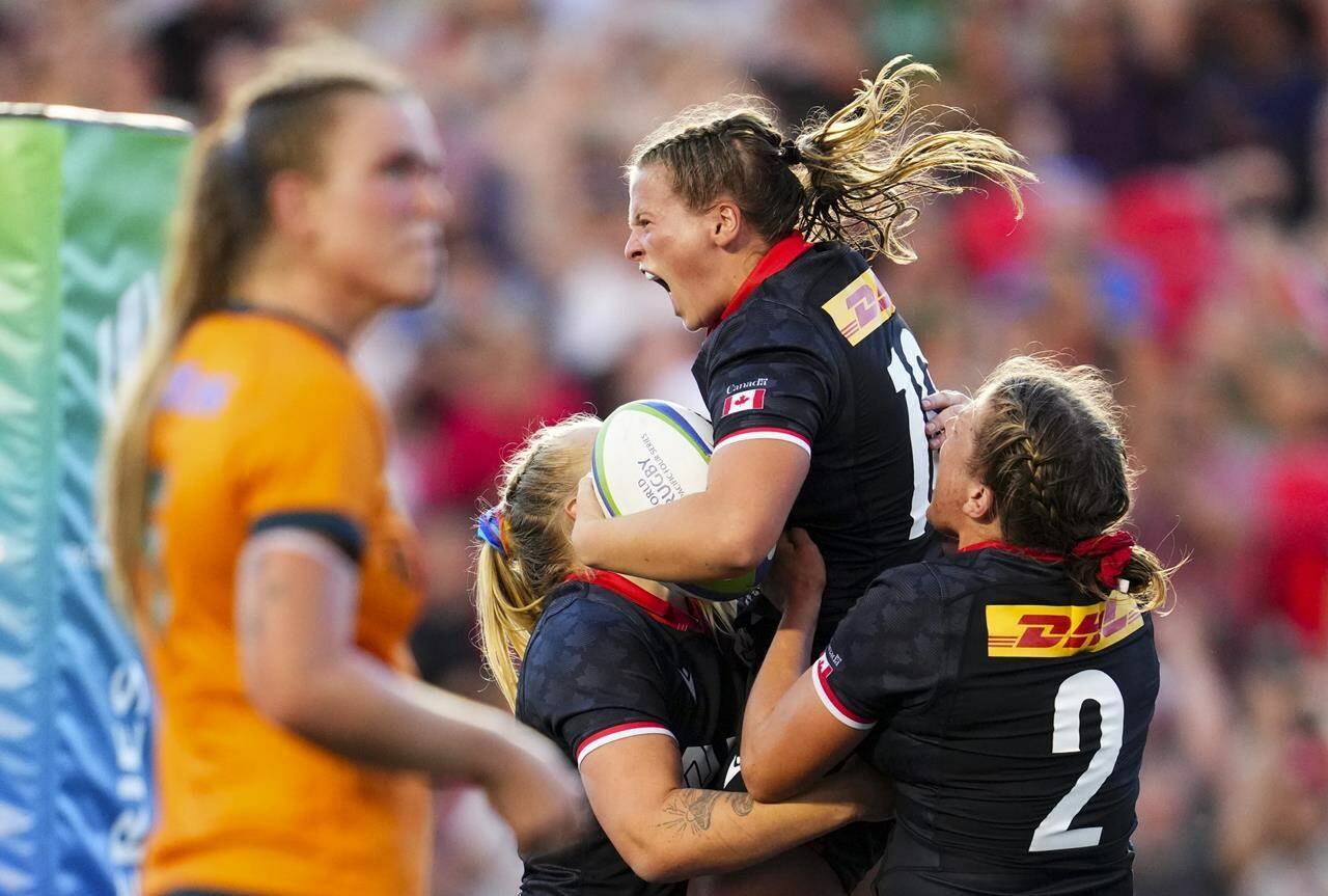 Canada’s Claire Gallagher (10) celebrates with teammates after scoring a try against Australia during second half rugby action at the Pacific Four Series in Ottawa on Friday, July 14, 2023. THE CANADIAN PRESS/Sean Kilpatrick