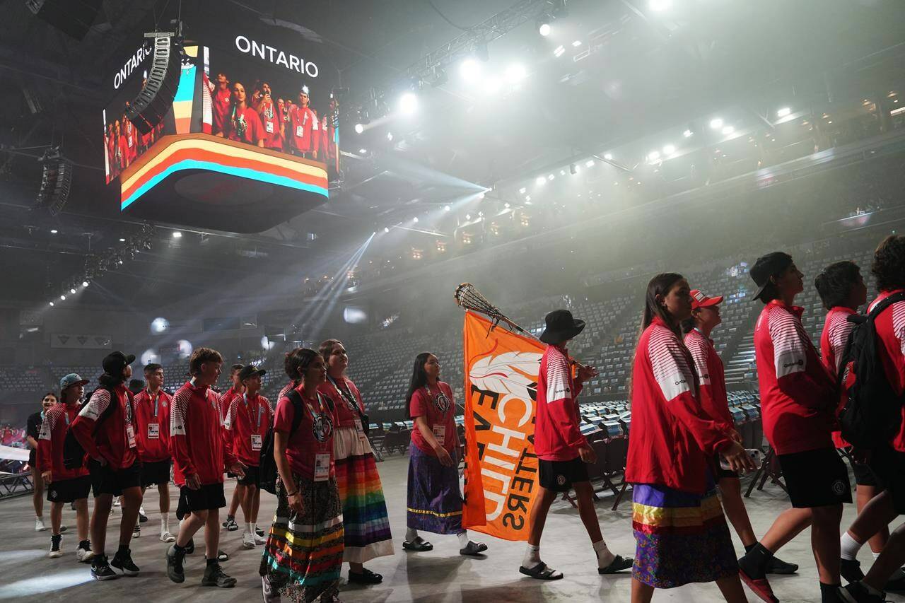 <div>The North American Indigenous Games have officially opened, with the prime minister attending as thousands of Indigenous athletes from across the continent filled the downtown Halifax Forum Civic Centre. An athlete from Team Ontario carries a “Every Child Matters” flag on a lacrosse stick during the opening ceremony of the North American Indigenous Games 2023 in Halifax, Sunday, July 16, 2023. THE CANADIAN PRESS/Darren Calabrese</div>
