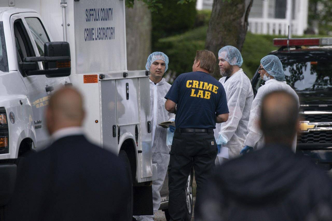 Crime laboratory officers arrive to the house where a suspect has been taken into custody on New York's Long Island in connection with a long-unsolved string of killings, known as the Gilgo Beach murders, Friday, July 14, 2023, in Massapequa Park, N.Y. (AP Photo/Eduardo Munoz Alvarez)