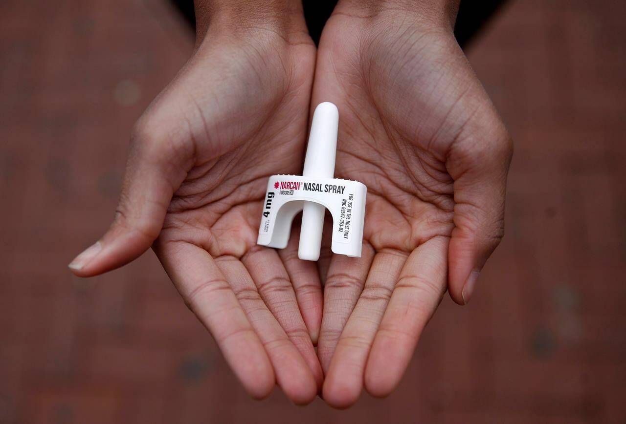 The chief of a municipal police force in Metro Vancouver has issued an open letter criticizing B.C.’s drug decriminalization policy as ineffective in the face of the ongoing overdose crisis. Leah Hill, a behavioral health fellow with the Baltimore City Health Department, displays a sample of Narcan nasal spray in Baltimore on Jan. 23, 2018. THE CANADIAN PRESS/AP-Patrick Semansky