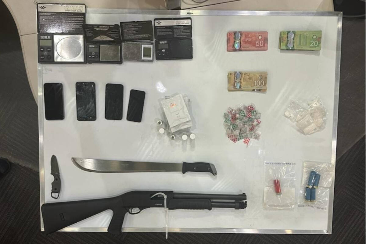 Two people are facing charges of trafficking among other offences after North Vancouver RCMP seized a gun, drugs and cash during a traffic stop on July 14, 2023. (North Vancouver RCMP)