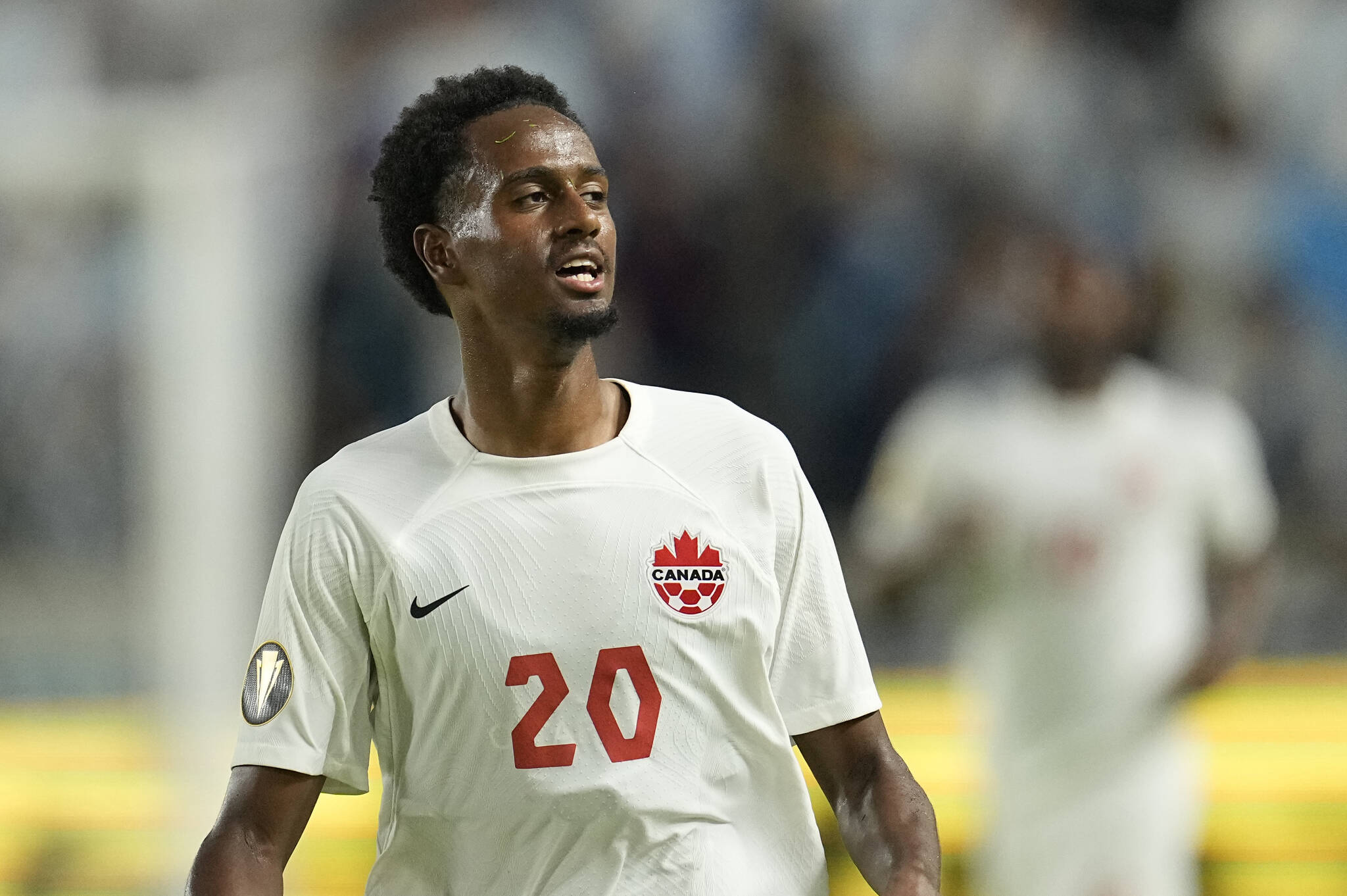 Canada’s Ali Ahmed (20) runs up the field during the second half of a CONCACAF Gold Cup soccer match against Guatemala Saturday, July 1, 2023, in Houston. (AP Photo/David J. Phillip)