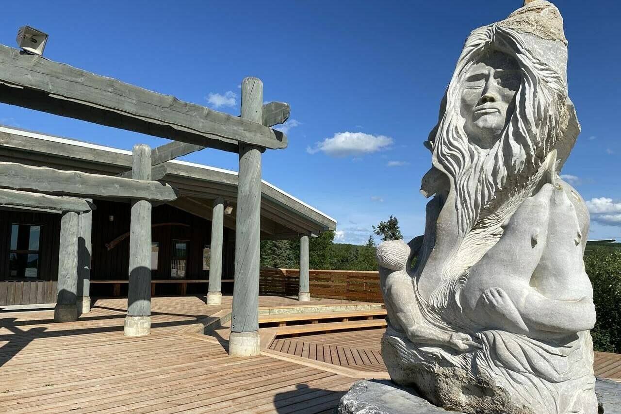 A soapstone carving is seen in front of the Western Arctic Regional Visitor’s Centre in Inuvik, N.W.T., Wednesday, July 5, 2023. Environment Canada says parts of the Northwest Territories are seeing record-breaking temperatures this summer as heat waves sweep the country. THE CANADIAN PRESS/Emily Blake