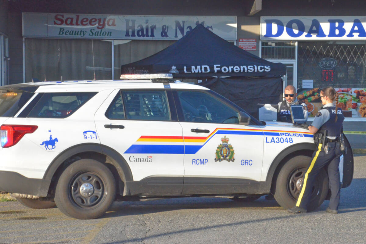 Langley RCMP were at the scene of a shooting Monday, July 25, 2022, in a parking lot on Logan Avenue near the bus loop. (Heather Colpitts/Langley Advance Times)