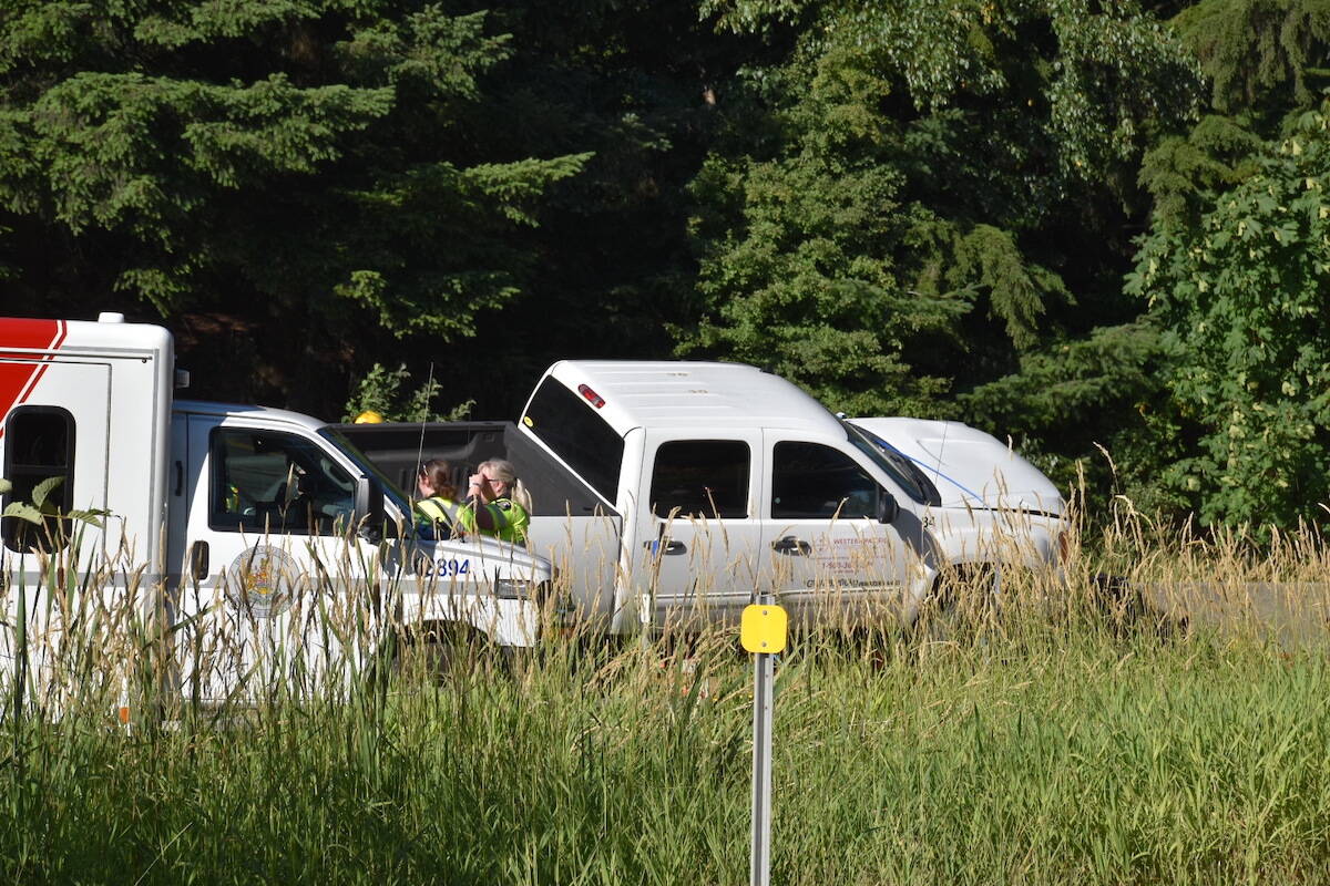 A motorcycle rider ended up under a pickup truck as a result of a crash near 264th Street on Highway 1 on Wednesday, July 11, witnesses said. (Curtis Kreklau/South Fraser News Services)