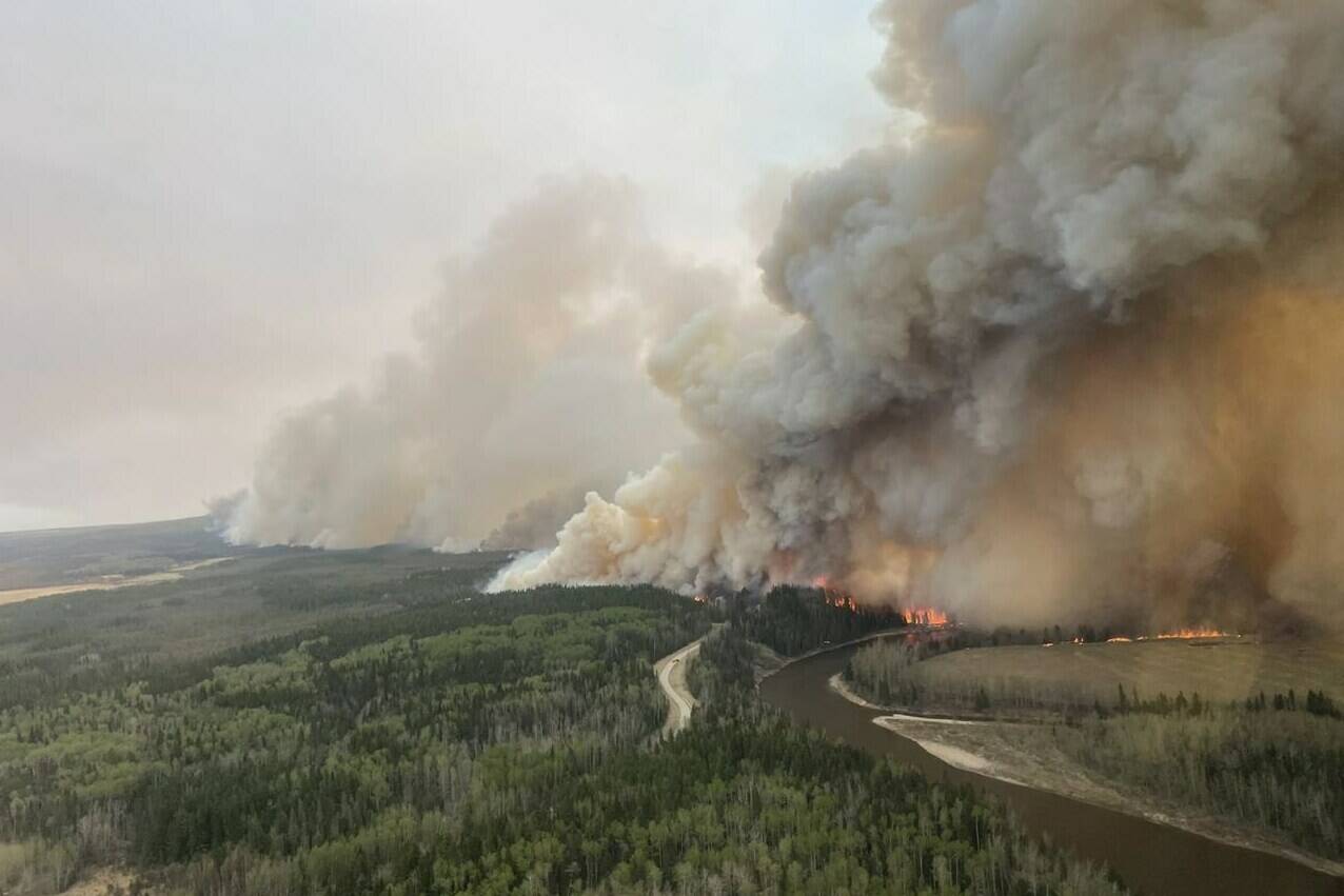 A large wildfire burns this handout image provided by the Government of Alberta and posted on their social media page. THE CANADIAN PRESS/HO-Government of Alberta- Alberta Wilfire