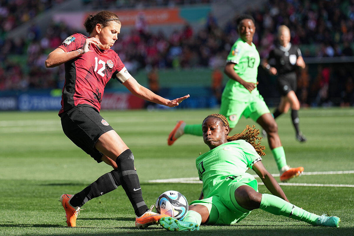 Canada’s Christine Sinclair battles for the ball with Nigeria’s Christy Ucheibe during first half Group B soccer action at the FIFA Women’s World Cup in Melbourne, Australia, Friday, July 21, 2023. THE CANADIAN PRESS/Scott Barbour