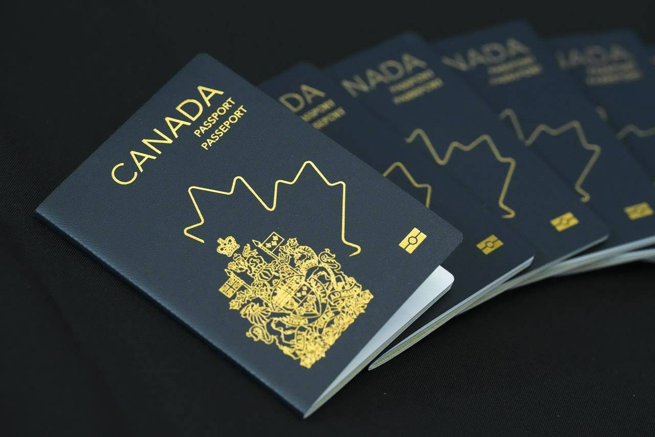 The new Canadian passport is unveiled at an event at the Ottawa International Airport in Ottawa on Wednesday, May 10, 2023. Canadians will never know what ideas were considered and rejected before the federal government finalized the newly reimagined and often lambasted design for the Canadian passport. THE CANADIAN PRESS/Sean Kilpatrick