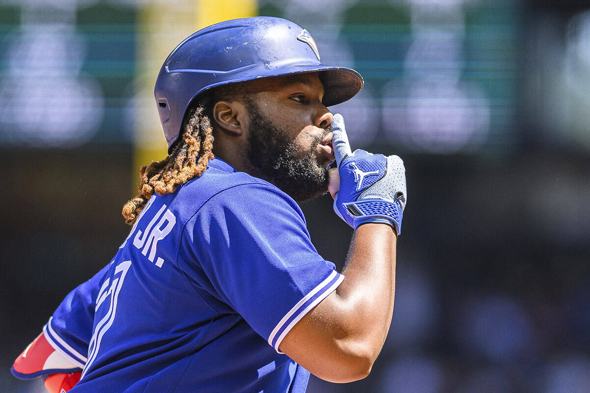 Toronto Blue Jays’ Vladimir Guerrero Jr. gestures as he rounds the bases after hitting a two-run home run during the fourth inning of a baseball game against the Seattle Mariners, Sunday, July 23, 2023, in Seattle. (AP Photo/Caean Couto)