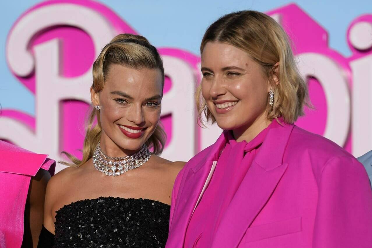 Margot Robbie, left, and writer/director/executive producer Greta Gerwig arrive at the premiere of “Barbie” on Sunday, July 9, 2023, at The Shrine Auditorium in Los Angeles. (AP Photo/Chris Pizzello)
