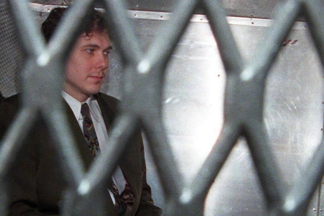 Paul Bernardo arrives at the provincial courthouse in the back of a police van in Toronto in a November 3, 1995 file photo. The federal Conservatives say Canadians angry over Bernardo's move to a medium-security prison have a Liberal government law to blame.THE CANADIAN PRESS/Frank Gunn