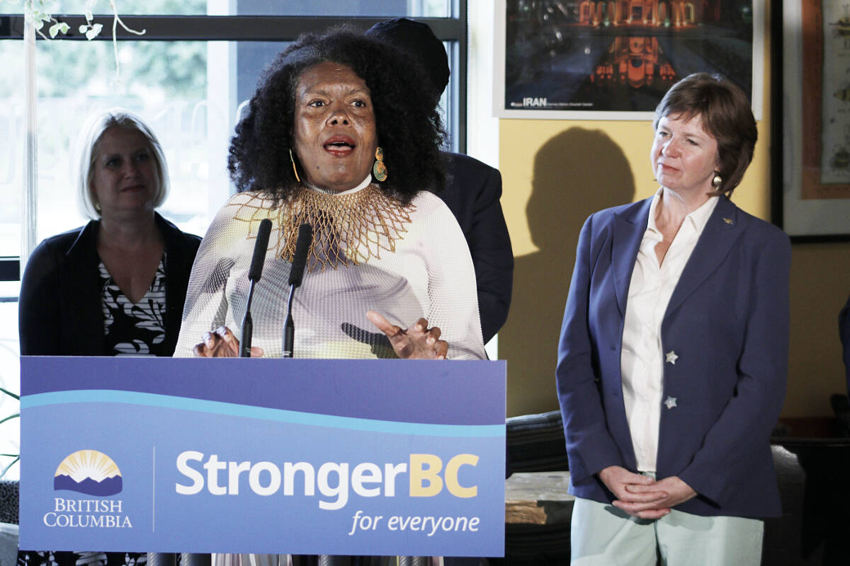 June Francis, chairperson of the anti-racism data committee, front, and B.C. Minister of Social Development and Poverty Reduction Sheila Malcolmson are among those calling on B.C. residents to fill out the new B.C. Demographics Survey to help curb systematic racism in government services. (Bailey Seymour/News Bulletin)