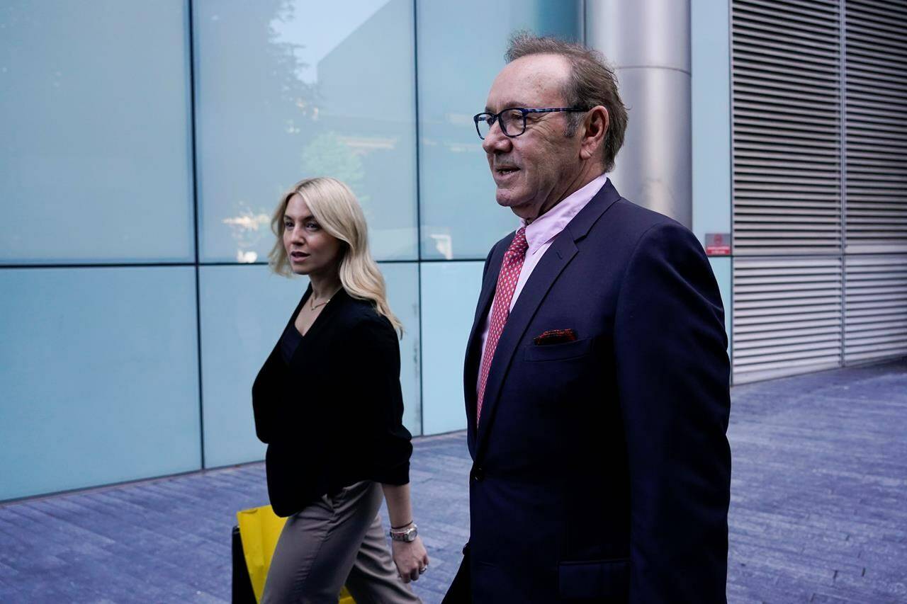 Actor Kevin Spacey, right, arrives at Southwark Crown Court in London, Wednesday, July 26, 2023. The Jury continues deliberations in the trial of Spacey, the Hollywood star, 63, denies nine charges including sexual assault, which are alleged to have been committed between 2001 and 2013. (AP Photo/Alberto Pezzali)