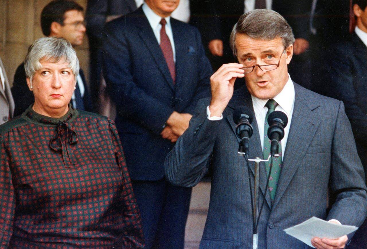 Prime Minister Brian Mulroney, along with Trade Minister Pat Carney, makes a statement after a day of briefing premiers on the state of the North American trade talks in this Sept. 14, 1987 file photo in Ottawa. Carney, a former member of Parliament, a senator and a trailblazer, died Tuesday at the age of 88. THE CANADIAN PRESS/Chuck Mitchell
