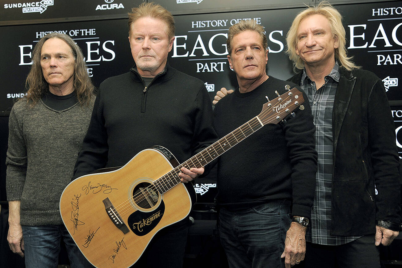 From left, Timothy B. Schmit, Don Henley, Glenn Frey and Joe Walsh of The Eagles pose with an autographed guitar after a news conference at the 2013 Sundance Film Festival, in Park City, Utah. Randy Meisner, the group’s founding bassist, died Wednesday night in Los Angeles of complications from chronic obstructive pulmonary disease. (Photo by Chris Pizzello/Invision/AP, File)