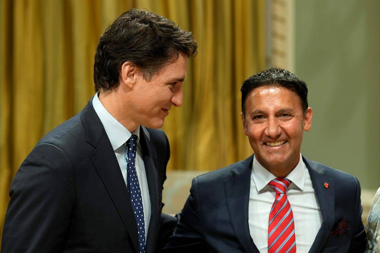 Minister of Justice and Attorney General of Canada Arif Virani poses for a photo with Prime Minister Justin Trudeau during a cabinet swearing-in ceremony at Rideau Hall in Ottawa, Wednesday, July 26, 2023. Canada's new justice minister says he plans to tell his staff and department to move "expeditiously" on addressing judicial vacancies, an issue which dogged his predecessors. THE CANADIAN PRESS/Adrian Wyld