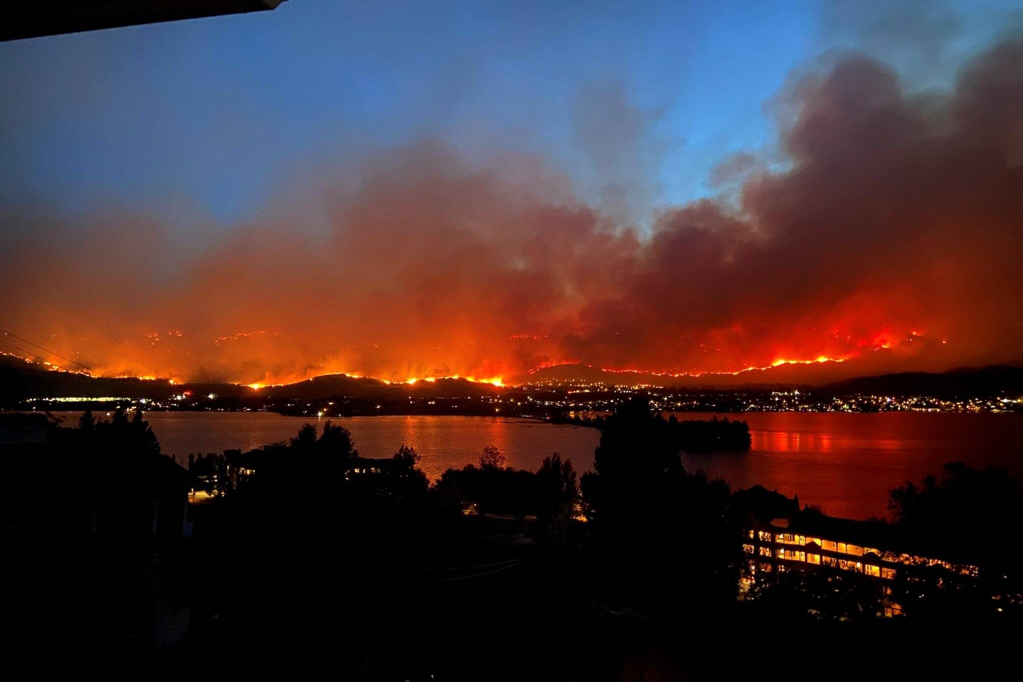 This photo from shortly before 10 p.m. on July 29 on the east side of Osoyoos shows the size of the fire threatening the community. (Kristine Fujita via Paul Scholz - Twitter)