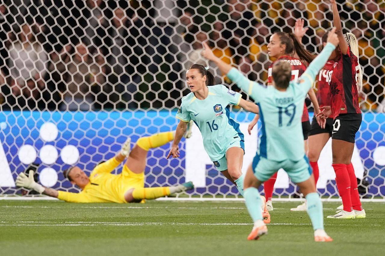 Hayley Raso (16) of Australia celebrates after scoring the first goal past Canada's keeper Kailen Sheridan during Group B soccer action at the FIFA Women's World Cup in Melbourne, Australia, Monday, July 31, 2023. THE CANADIAN PRESS/Scott Barbour