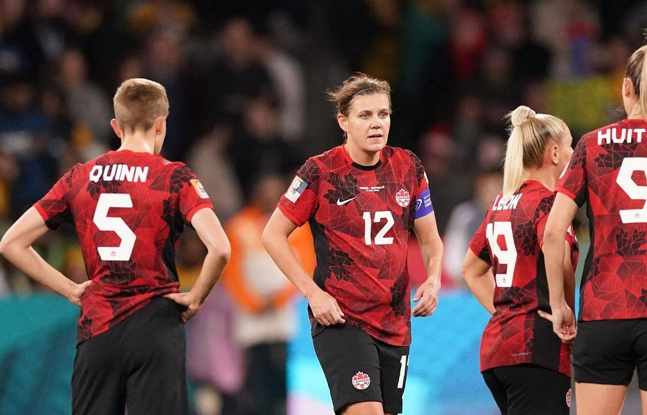 Canada’s Christine Sinclair, centre and teammates react after conceding a first half goal during Group B soccer action against Australia at the FIFA Women’s World Cup in Melbourne, Australia, Monday, July 31, 2023. THE CANADIAN PRESS/Scott Barbour