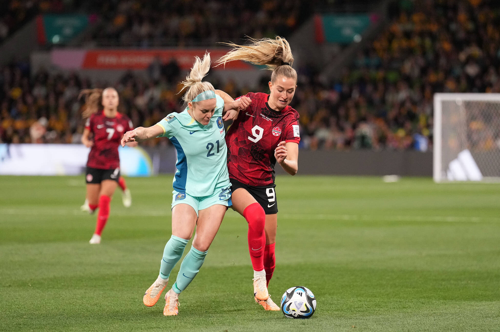 Ellie Carpenter of Australia and Jordyn Huitema of Canada vie for the ball during Group B soccer action at the FIFA Women’s World Cup in Melbourne, Australia, Monday, July 31, 2023. THE CANADIAN PRESS/Scott Barbour