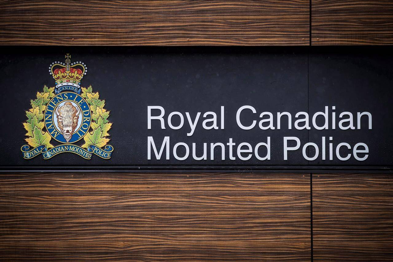 The RCMP logo is seen outside Royal Canadian Mounted Police “E” Division Headquarters, in Surrey, B.C., on Friday April 13, 2018. Prince George RCMP say that investigations into two unrelated deaths of women in the city within a day are now being investigated as homicides. THE CANADIAN PRESS/Darryl Dyck