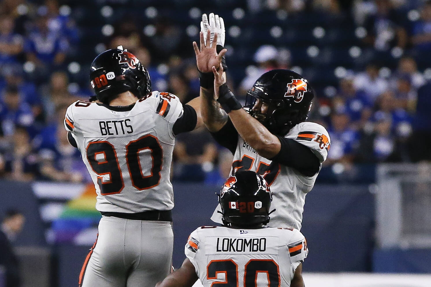 B.C. Lions’ Mathieu Betts (90), Sione Teuhema (47) and Bo Lokombo (20) celebrate BettsÕ sack of Winnipeg Blue Bombers quarterback Zach Collaros (8) during second half CFL action in Winnipeg Thursday, June 22, 2023. THE CANADIAN PRESS/John Woods