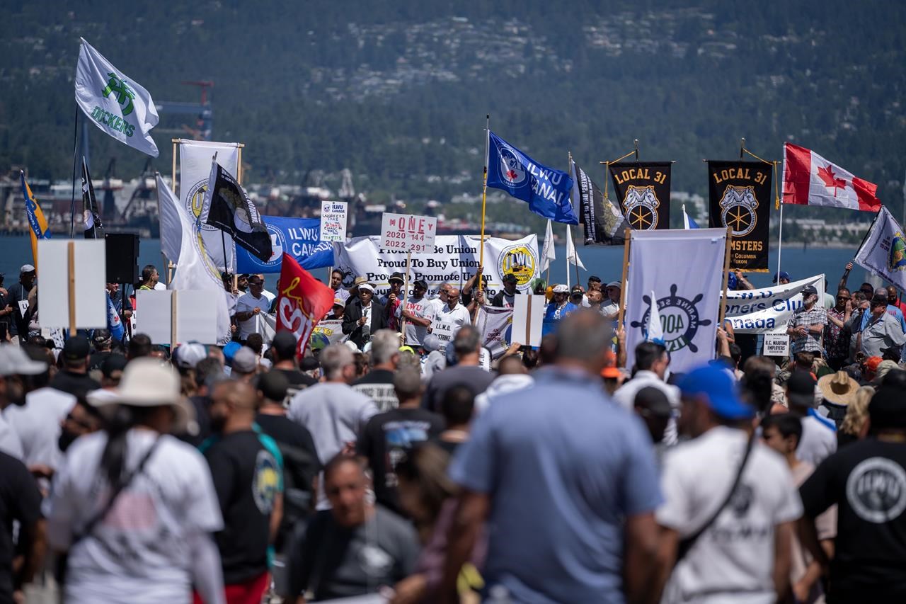 Workers attend a strike rally in Vancouver on Sunday, July 9, 2023. Workers in the ongoing British Columbia port dispute are taking a full-union vote to determine if the latest deal recommended by negotiators is acceptable, with the possible end to the months-long conflict in the balance. THE CANADIAN PRESS/Ethan Cairns