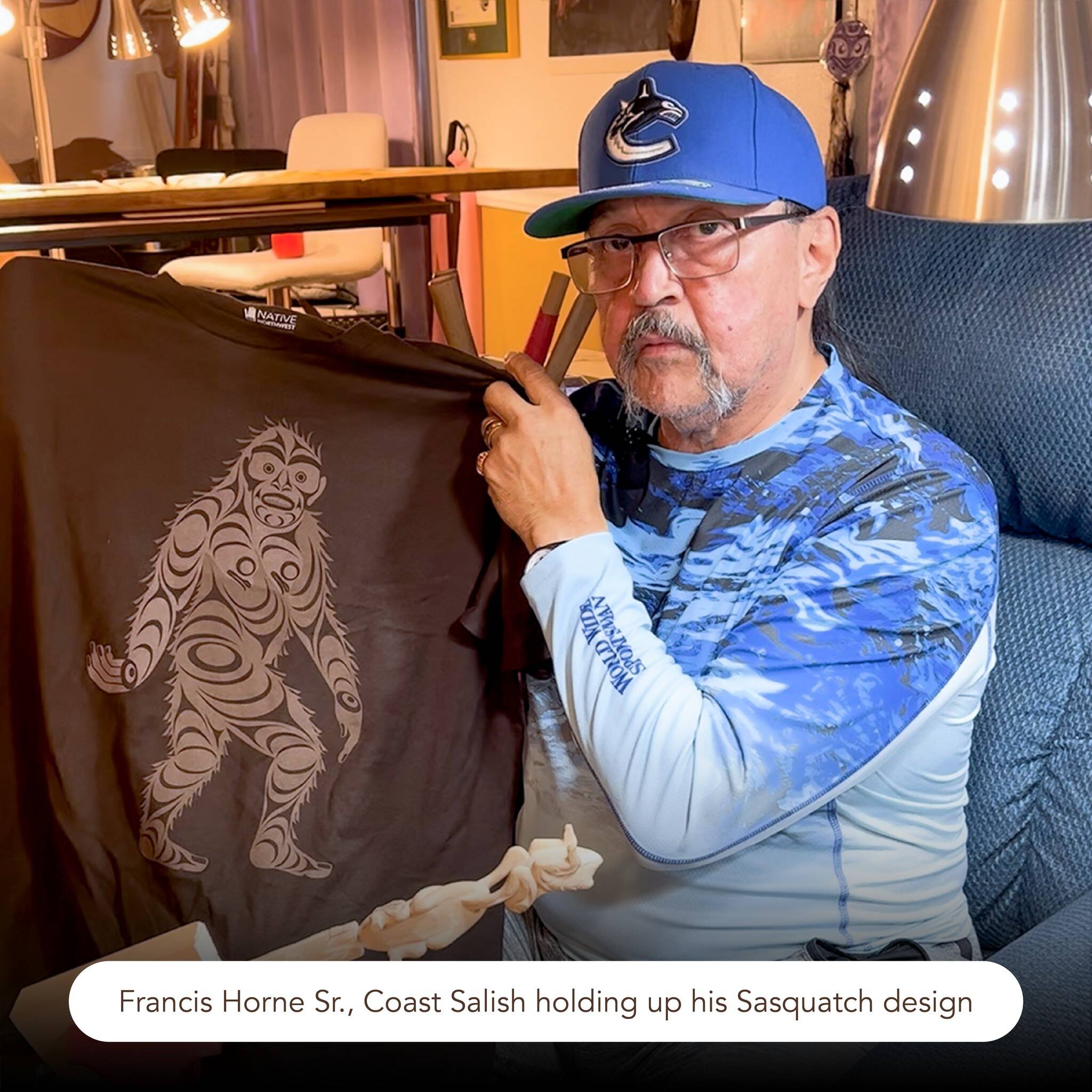 Coast Salish artist Francis Horne, Sr. holds up a t-shirt featuring his design. A lawsuit from Indigenous art wholesaler Native Northwest alleges Sasquatch Gifts and Souvenirs sold t-shirts that featured his design without permission. (Photo/Native Northwest)