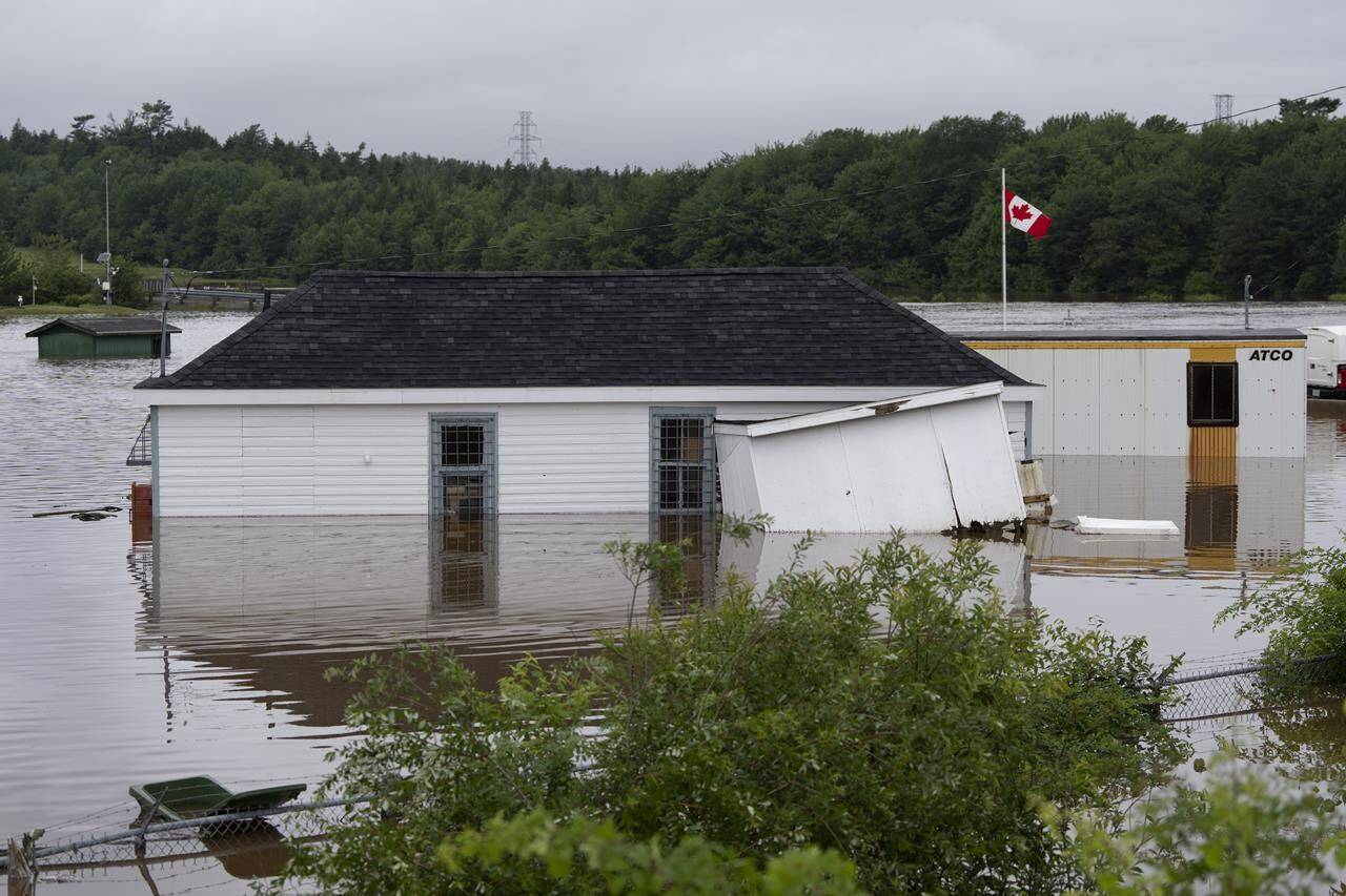Buildings are seen in floodwater following a major rain event in Halifax on Saturday, July 22, 2023. THE CANADIAN PRESS/Darren Calabrese
