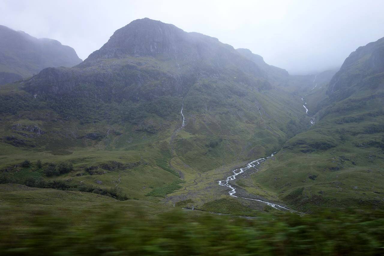 The Scottish Highlands are shown in this 2017 photo. Police say the bodies of three missing hikers have been recovered from a mountain in the Scottish Highlands. A search for the trio began Saturday night when they didn’t return from hiking along a notoriously narrow ridge in Glen Coe. A Coastguard helicopter flying in fog and mist located the bodies and a search and rescue crew returned Sunday to recover them. (AP Photo/Brian Melley)