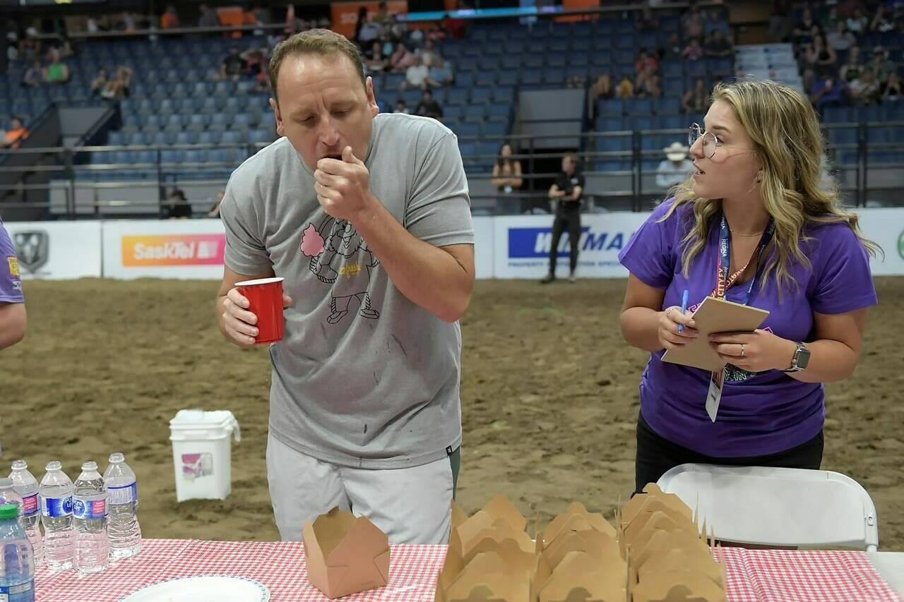 Hot dog champ Chestnut smashed his own record for eating mini doughnuts at Regina’s Queen City Ex this weekend. (The Canadian Press)