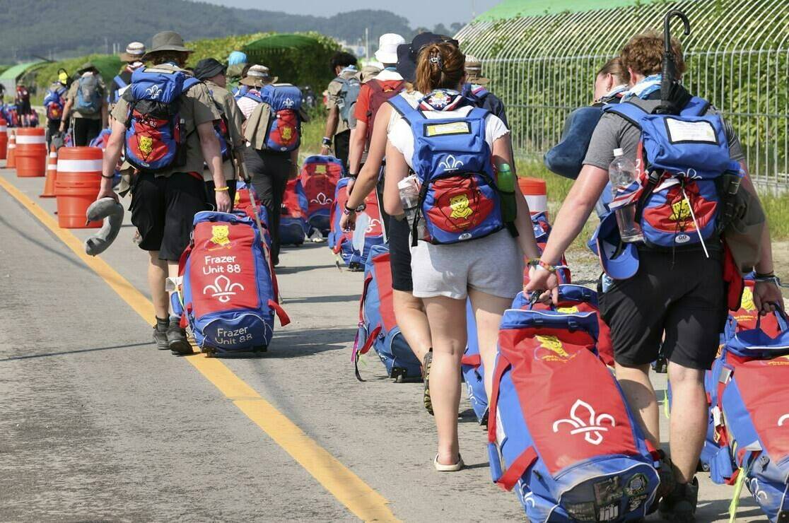 British scout members leave the World Scout Jamboree campsite in Buan, South Korea, Sunday, Aug. 6, 2023.South Korean officials they will evacuate tens of thousands of scouts, including hundreds of Canadians, from an international scouting jamboree along the country’s western coast before the expected arrival of a typhoon. THE CANADIAN PRESS/AP-Choe Young-soo/Yonhap via AP