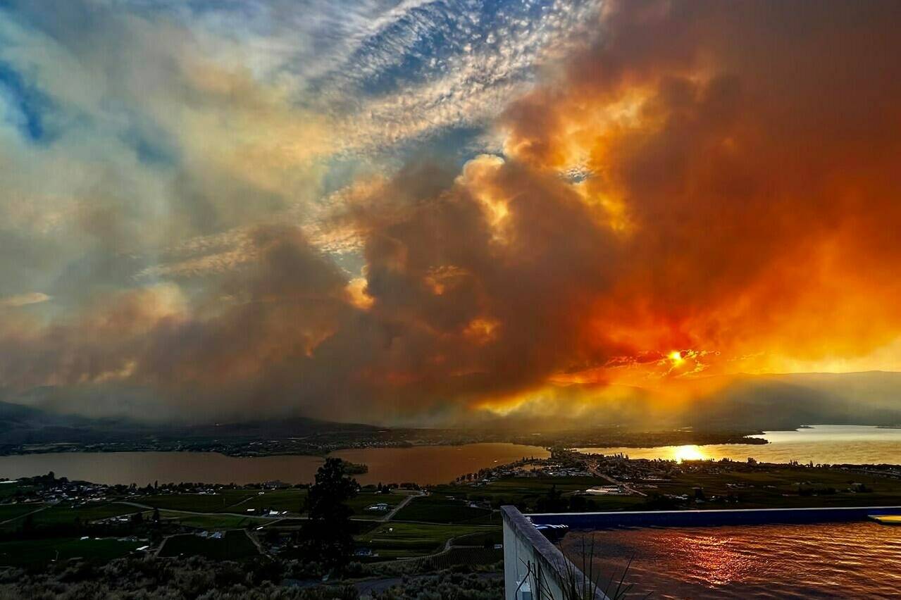 The Eagle Bluff wildfire is seen burning from Anarchist Mountain, outside of Osoyoos, B.C., in a Saturday, July 29, 2023, handout photo. All evacuation orders have now been lifted around the southern British Columbia community that saw a wildfire burn to its doorstep late last month as flames swept north across the border from Washington state.THE CANADIAN PRESS/HO-Melissa Genberg