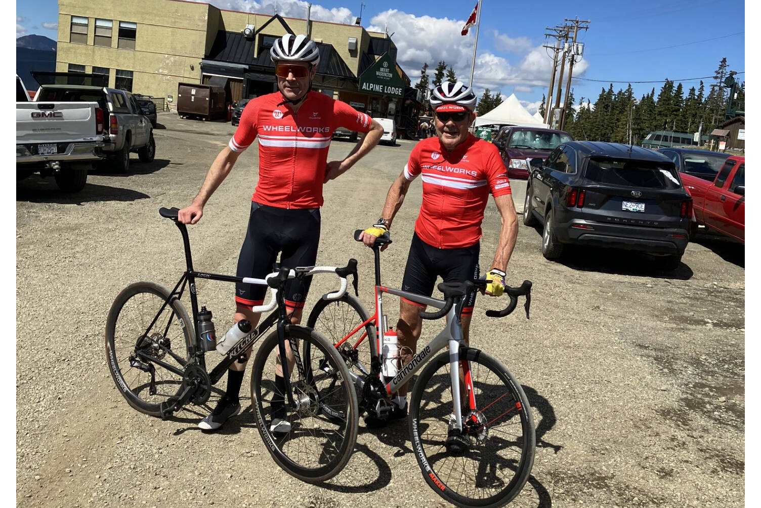 Roger (right) and Tristan Thomas pose for a shot at the Alpine Lodge parking lot at the completion of their ascent up Mount Washington on Aug. 3. The father and son completed the ride in celebration of Roger’s 82nd birthday. Photo supplied.