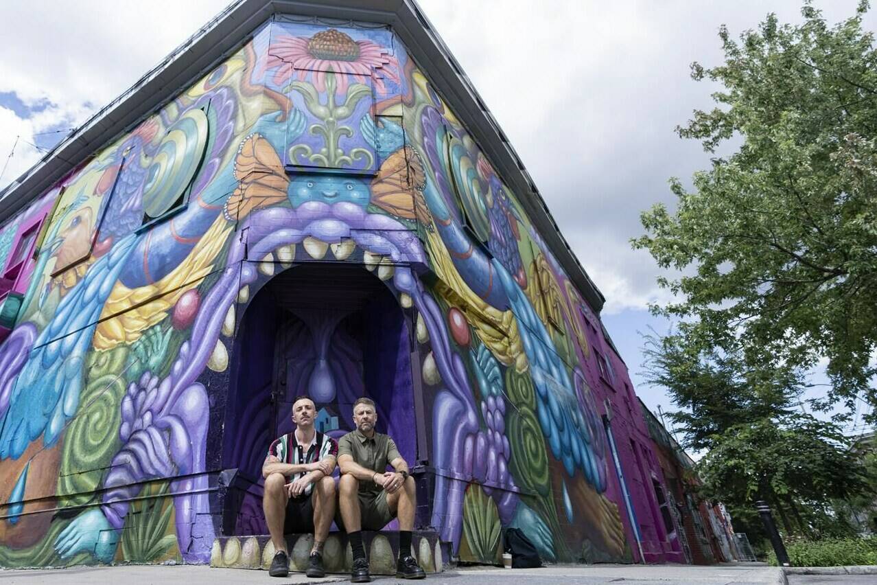 Canadian filmmakers Sean Horlor, left and Steve J. Adams pose in Montreal on Monday, July 31, 2023. Their latest documentary, “Satan Wants You,” is an exploration of the Canadian roots of the so-called “satanic panic” of the 1980s and ’90s. THE CANADIAN PRESS/Christinne Muschi