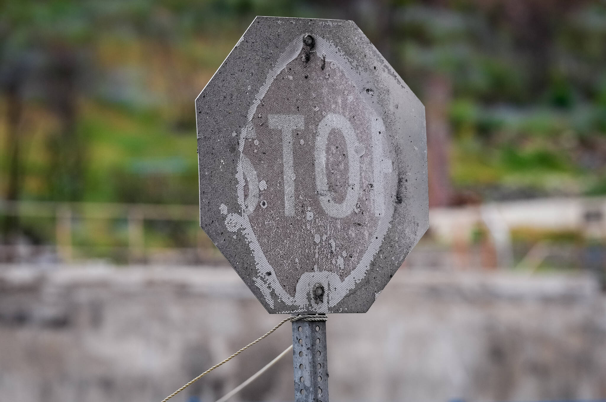 A stop sign that was burned by wildfire is seen, in Lytton, B.C., on Tuesday, June 14, 2022. The fire-ravaged community of Lytton, B.C., will get $77 million from the federal government to help it rebuild a fire-resistant and energy-efficient community. Two people were killed and much of the centre of the village was destroyed when wildfire ripped through the community almost a year ago. THE CANADIAN PRESS/Darryl Dyck