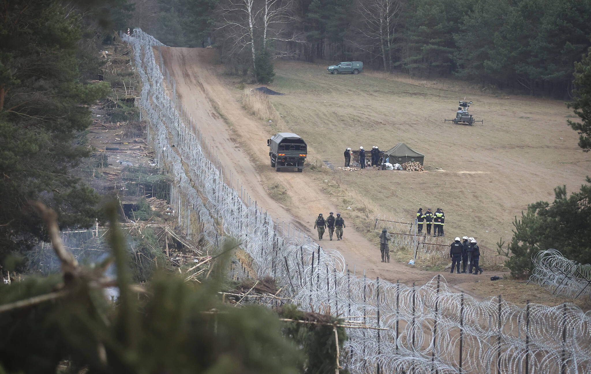 A general view of a deserted migrants’ camp near the checkpoint “Kuznitsa” at the Belarus-Poland border near Grodno, Belarus, on Thursday, Nov. 18, 2021. Poland’s defense minister said Saturday (Aug. 12) that the country has increased the number of troops protecting its border with Belarus as a deterrent amid “destabilizing” actions by its pro-Russian neighbor. (Leonid Shcheglov/BelTA via AP)