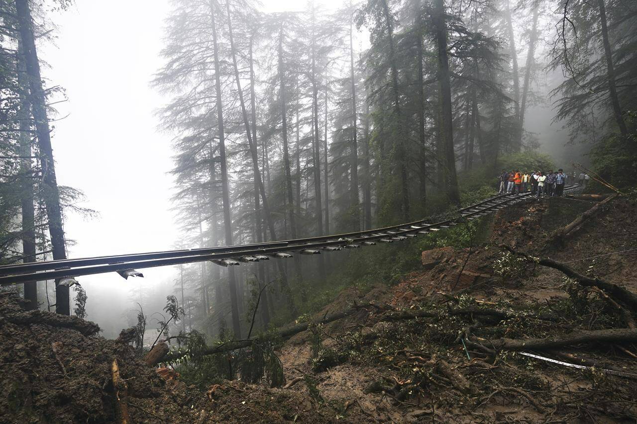 A portion of the Shimla-Kalka heritage railway track that got washed away following heavy rainfall on the outskirts of Shimla, Himachal Pradesh state, Monday, Aug.14, 2023. Heavy monsoon rains triggered floods and landslides in India’s Himalayan region, leaving more than a dozen people dead and many others trapped, officials said Monday. (AP Photo/ Pradeep Kumar)