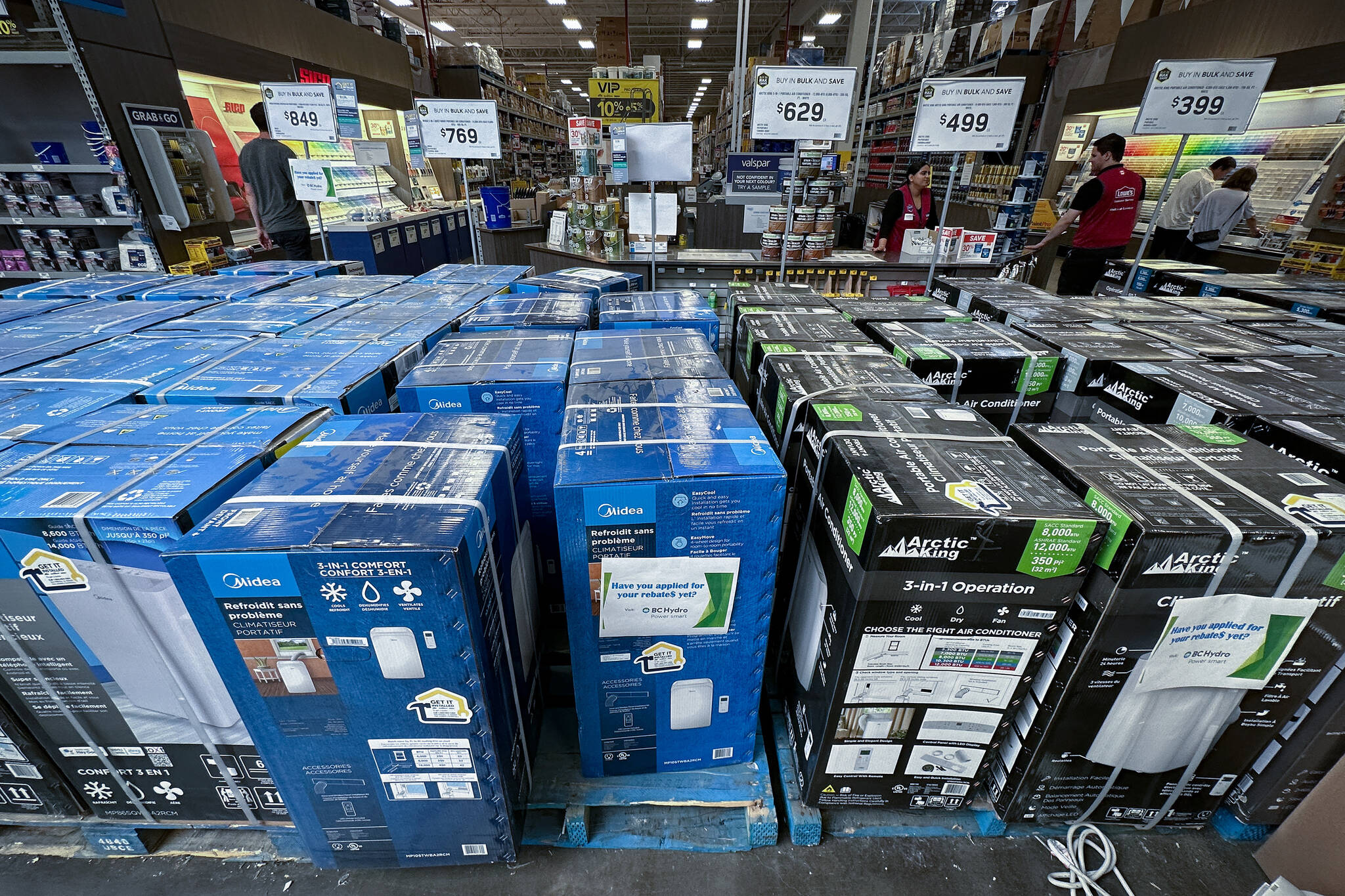 Portable air conditioners are seen at a store in Vancouver, on Saturday, August 5, 2023. THE CANADIAN PRESS/Darryl Dyck