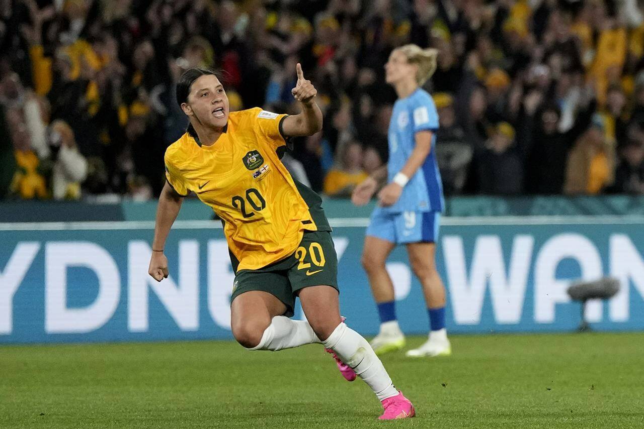 Australia’s Sam Kerr celebrates after scoring her side’s first goal during the Women’s World Cup semifinal soccer match between Australia and England at Stadium Australia in Sydney, Australia, Wednesday, Aug. 16, 2023. (AP Photo/Rick Rycroft)