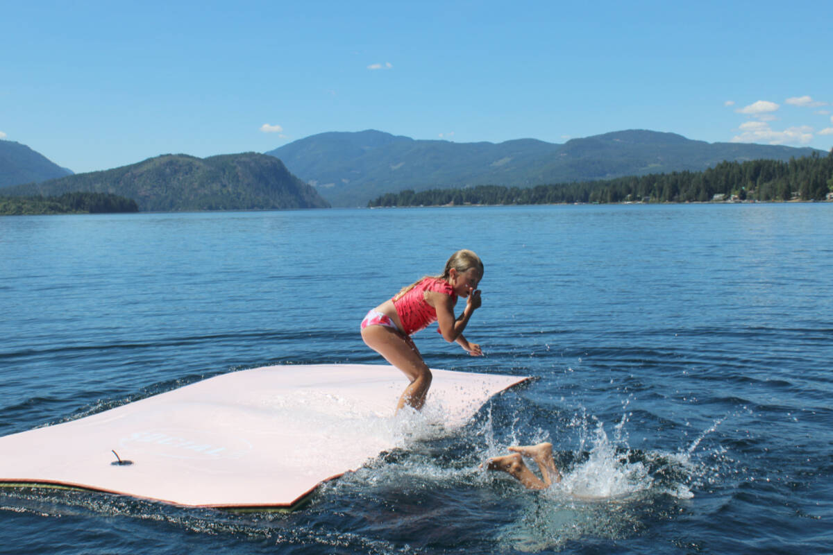 Linden Zoet, 7, and Dallas Fraser, 9, have fun at the Sproat Lake Water Sports Association on July 19, 2023. Sproat Lake has been named B.C.’s best lake in a CBC competition. (SONJA DRINKWATER / Special to the AV News)