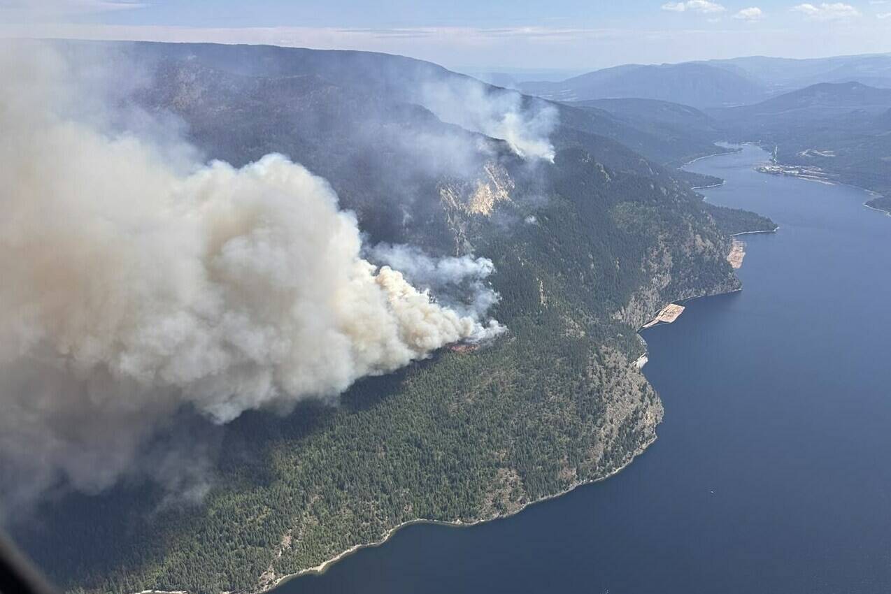 The Lower East Adams Lake wildfire in B.C.’s Shuswap region is shown in a handout photo. Wildfire crews in British Columbia are bracing for an incoming weather system expected to bring strong winds and dry lightning by Thursday, but conditions are already flaring in at least two areas of the province. THE CANADIAN PRESS/HO-BC Wildfire Service