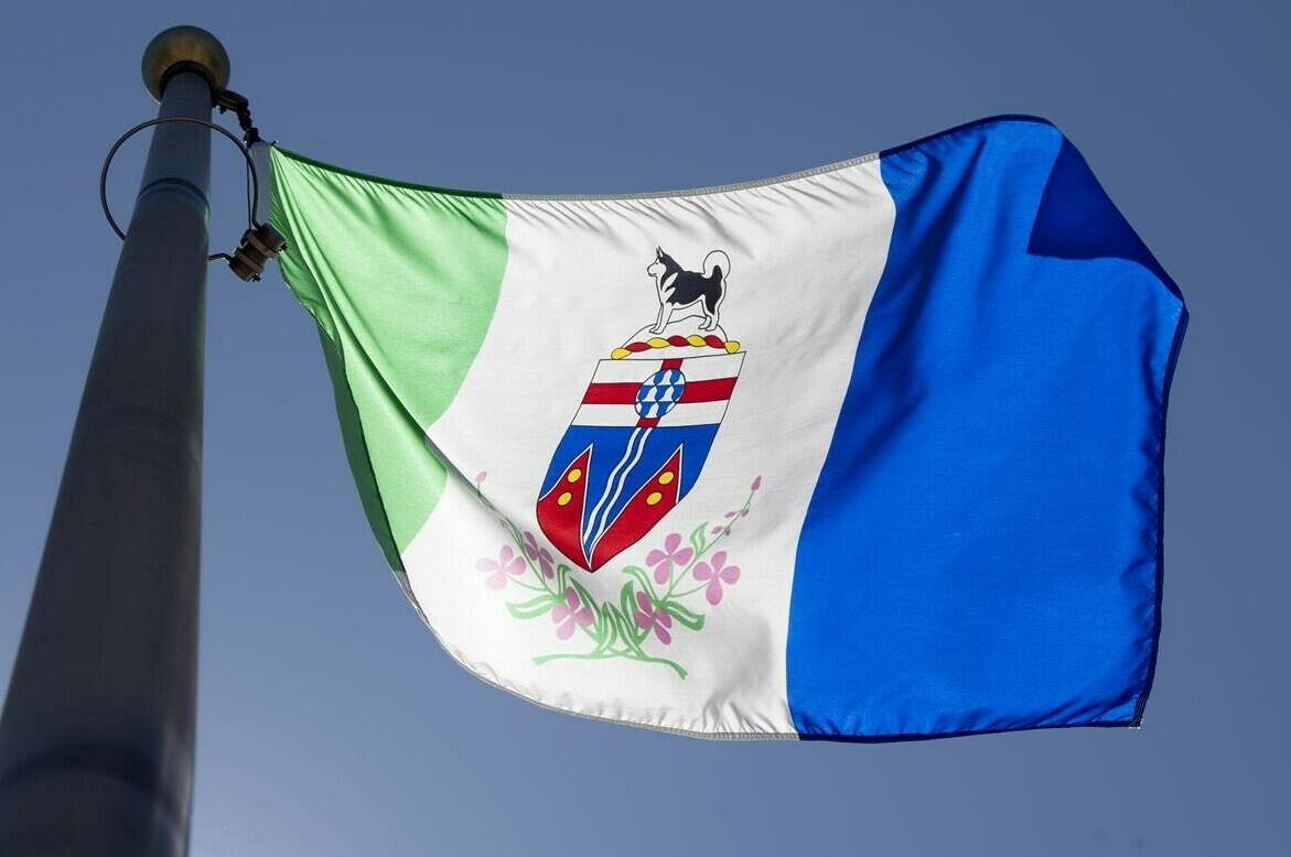 The Yukon territorial flag flies in Ottawa on Monday, July 6, 2020. An evacuation order for Yukon’s northernmost community of Old Crow has been rescinded. THE CANADIAN PRESS/Adrian Wyld
