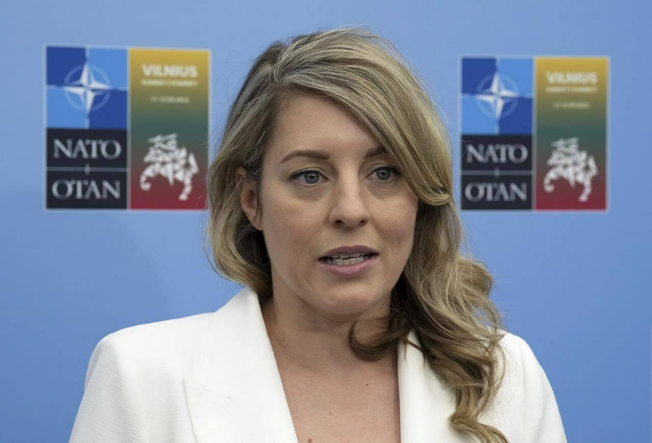 Foreign Affairs Minister Melanie Joly speaks with reporters at the NATO Summit in Vilnius, Lithuania, Tuesday, July 11, 2023. Joly says Canada has been considering a “game plan” for how it would respond if the United States takes a far-right, authoritarian shift after next year’s presidential elections. THE CANADIAN PRESS/Adrian Wyld
