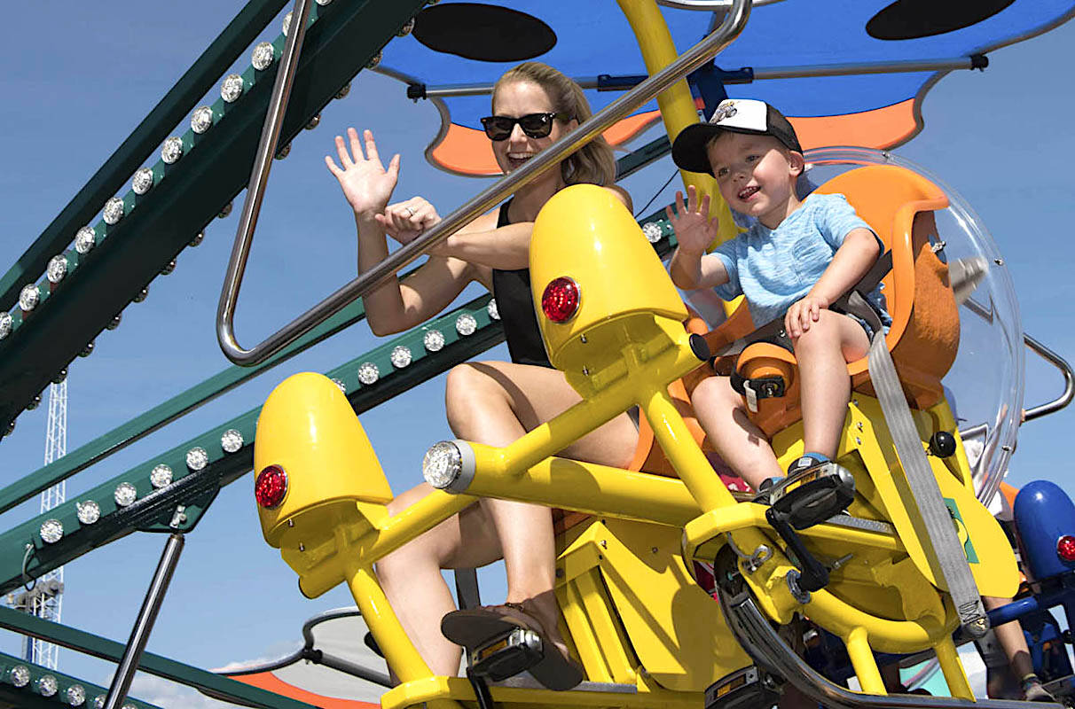 Mother and child on the Flutterbye ride at the PNE fair a few years ago. (File photo)