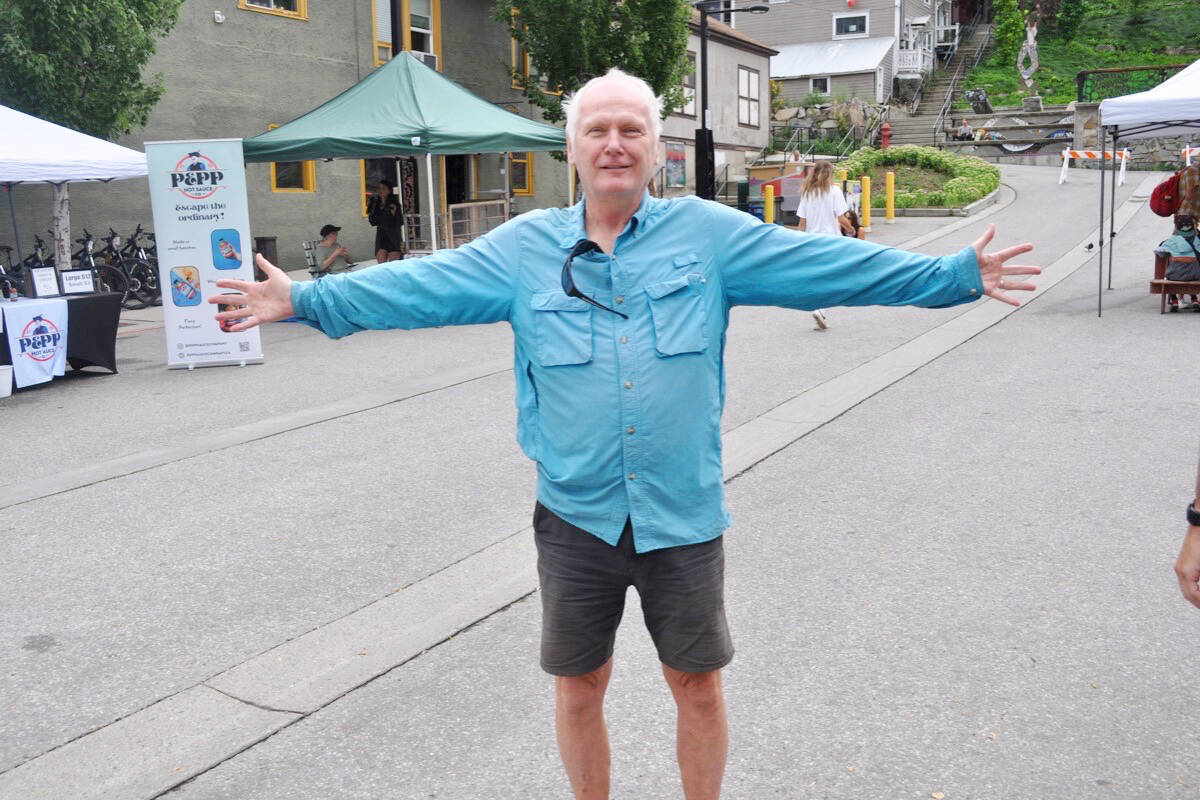 George Chandler shows off Hall Street Plaza, which is car-free during Nelson’s weekly Wednesday farmers’ market but is typically a parking lot. Chandler has co-organized a downtown block to be closed to vehicles on Aug. 20. Photo: Tyler Harper