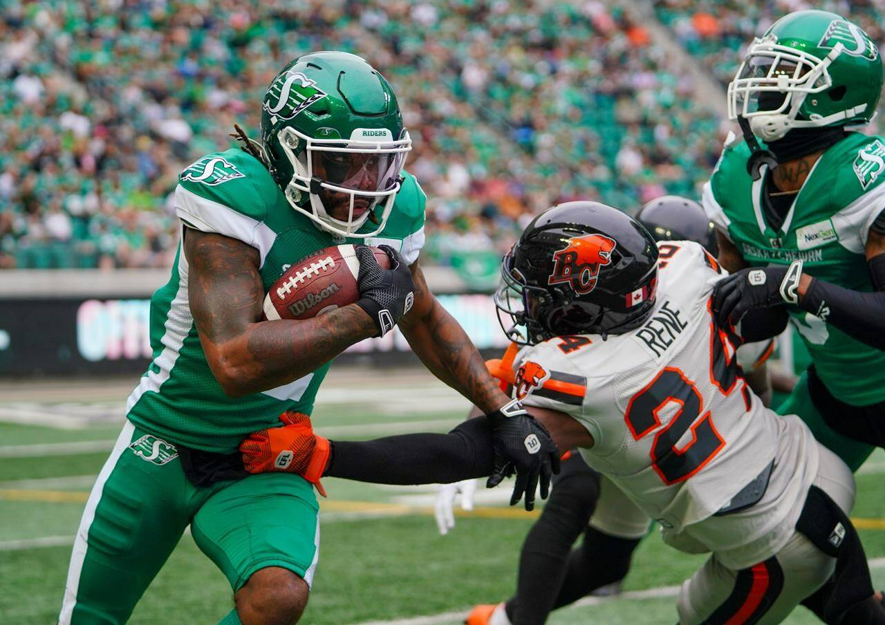 Saskatchewan Roughriders punt returner Mario Alford (2) runs the football against BC Lions during the first half of CFL football action in Regina, on Sunday, Aug. 20, 2023. THE CANADIAN PRESS/Heywood Yu